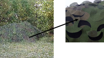 Tent with camouflage netting transitioning to a detail shot of the netting Tent with camouflage netting transitioning to a detail shot of the netting